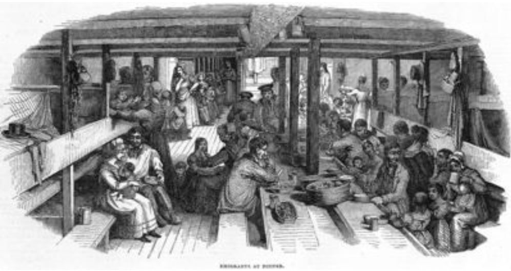 Engraving of emigrant families eating at long tables below deck on a sailing ship